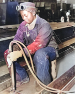 Female African-American shipyard worker Anna Bland working on Liberty ship SS George Washington Carver at Kaiser Richmond No. 1 Yard, Richmond, California, United States, Apr 1943