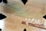 Gun camera view of a P-51 fighter preparing to strafe a train on the Pinghan Railway (now Beijing-Hankou Railway), Hebei Province, China, Apr 1945