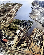 Aerial view of Permanente Metals Shipyard No. 1 looking south into San Francisco Bay, Richmond, California, United States, 11 Dec 1944. Note the prefabrication shed on the left and the large Ford assembly plant at top.