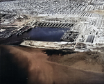 Aerial view of Permanente Metals Shipyard No. 2 looking north, Richmond, California, United States, 11 Dec 1944. Note the prefabrication sheds on the left angled 45-degrees to everything else.