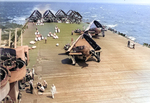 SB2C Helldivers of Bombing Squadron VB-19 on the deck of USS Lexington (Essex-class) being fitted with drop tanks for an extended mission to search for the fleeing Japanese fleet, 25 Oct 1944.