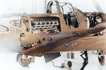 P-39 Airacobra aircraft with maintenance panels open, revealing the engine and other internal workings, date unknown