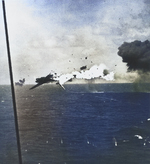 A B6N2 torpedo bomber exploding in mid-air after direct hit by 5-inch shell from carrier Yorktown, off Kwajalein, Marshall Islands, 4 Dec 1943