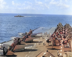 SB2C-5 Helldiver and F4U Corsair aircraft of US Navy squadrons VB-89 and VF-89 aboard USS Antietam, 1945; note USS Higbee in background