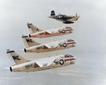 Lynn Garrison flying a F4U-7 Corsair fighter with three A-7A-4a-CV Corsair II jet attack aircraft, 7 Jul 1967