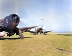 F4U-4 Corsair fighters of US Marine Corps squadron VMF-323 at an airfield at Seoul, Korea, 29 Apr 1951. Note the HVAR rockets on the Corsair in the background.