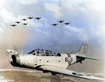 Torpedo Squadron 6 TBD-1 Devastator aircraft of USS Enterprise in flight in foreground, with an additional nine TBD-1 aircraft in background, 1938