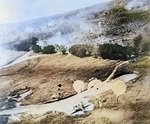 American parachute fragmentation bomb descending onto a Japanese airfield, circa 1943-1945; note G4M aircraft on the ground