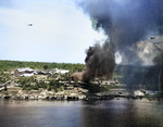 Peleliu, Palau Islands under attack by US Navy carrier aircraft, 30 Mar 1944; note F6F Hellcat fighter in flight