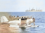 United States Coast Guard J2F-6 Duck aircraft resting in Antarctic waters during Operation Hughjump, 7 Jan 1947; ship in background was either USS Yancey or USS Merrick