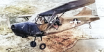 United States Marine Corps Stinson OY-1 Sentinel over Naha, Okinawa, Japan, circa Jun 1945, photo 1 of 2