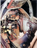 Close-up view of a P-38G Lightning aircraft cockpit, 23 Dec 1942; note the yoke rather than stick control and the bullet proof glass panel above the instrument panel. Photo 1 of 3.