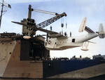 PBM-3 Mariner aircraft of US Navy patrol bomber squadron VPB-210 hoisted aboard seaplane tender Albemarle, Guantanamo Bay, Cuba, 5 Jan 1945