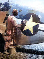 US Army African-American Staff Sergeant William Accoo, crew chief of a P-51 Mustang aircraft, washed the aircraft he was in charge of, Italy, circa Sep 1944