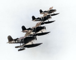 SOC-3 Seagull aircraft from cruiser Portland flying in a formation of four, circa 1944, photo 2 of 2