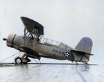 SOC-3A Seagull floatplane of US Navy Scouting Squadron 201 (VS-201) parked on the deck of escort carrier Long Island, 16 Dec 1941, photo 1 of 3