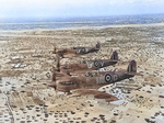 Three British Spitfire Vb fighters in flight over Djerba Island, Gulf of Gabes, Tunisia, early 1943