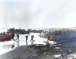 US Army soldiers unloading LCPR and LCM type landing craft on the beach at Massacre Bay, Attu, Aleutian islands, 12 May 1943; note military policemen on right side of photo