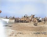 Unloading equipment on a beach near Salerno, Italy, Sep 1943