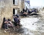 Men of US Army 2nd Infantry Division advancing into Brest, France under German machine gun fire, 9 Sep 1944