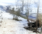 Two soldiers of US 101st Airborne Division manning a forward post near a road, near Bastogne, Belgium, 23 Dec 1944