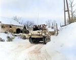 Men of Company I, 3d Battalion, 16th Infantry Regiment, US 1st Division riding on M4 Sherman tank at Schopen, Belgium, 21 Jan 1945