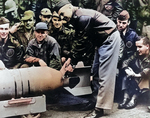 Doolittle wiring a Japanese medal to a bomb, Apr 1942, 2 of 2