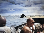 US Coast Guard personnel transporting supplies to Tarawa, Gilbert Islands, circa 20-23 Nov 1943; note the wreck of an American LCVP in center of photo