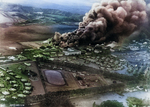 P-40 fighters and hangars burning at Wheeler Field, US Territory of Hawaii, 7 Dec 1941; photo taken from a Japanese aircraft