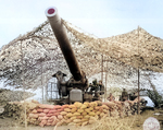 Men of 697th Field Artillery Battalion firing 240mm howitzer at Mignano, Italy, 30 Jan 1944