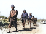 Japanese-American soldiers of the US 100th Infantry Battalion marching in the Valletri area of Italy, 28 May 1944