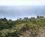 A Japanese patrol vessel wrecked on the rocky coast of northern Iwo Jima, 21 Apr 1945