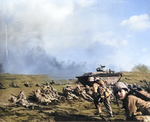 Men of US Marines, Second Battalion, Seventh Regiment waited to move inland on Iwo Jima, soon after going ashore, 19 Feb 1945