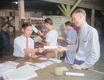 Postmaster Fred Paris with workers at the Jerome War Relocation Center post office, Arkansas, United States, 20 Nov 1942