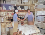 Chief cook Hamazaki and storekeeper Jimmy Saito at the storeroom of Mess Hall 7 of Jerome War Relocation Center, Arkansas, United States, 18 Nov 1942