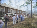 Men digging drainage ditches between barracks buildings, Jerome War Relocation Center, Arkansas, United States, 16 Nov 1942