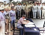 Nimitz signing the instrument of surrender, Tokyo Bay, Japan, 2 Sep 1945, photo 1 of 2