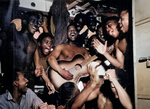 US Navy African-American enlisted sailors aboard USS Ticonderoga celebrating upon hearing the news of Japanese surrender, 14 Aug 1945