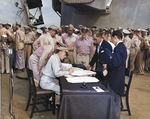 Lieutenant General Sutherland correcting Japanese surrender document, 2 Sep 1945, photo 1 of 2