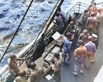 US Army troops of the 3rd Infantry Division drew ammunition on board USS Joseph T. Dickman (AP-26), off Morocco, 7 Nov 1942