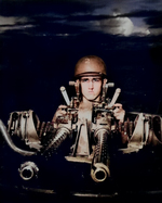 A PT boat gunner at his 50-cal machine gun, New Guinea, Jul 1943