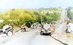 Abandoned German equipment on a road to Avranches, France during Operation Cobra, 31 Jul 1944