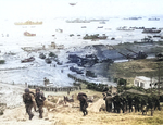 Reinforcements of men and equipment moving inland at Omaha Beach, Normandy, 8 Jun 1944