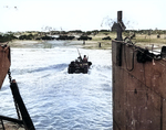 US Army weapons carrier moved through the surf toward Utah Beach, Normandy, after being launched from its landing craft, 6 Jun 1944