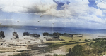 LSTs unloading at low tide in the Easy sector of Omaha Beach, Normandy, 28 Jun 1944, photo 2 of 2; note wrecked LCI(L) in the center