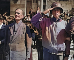 An US Army colonel and a French civilian in Cherbourg during the playing of the American national anthem, 28 Jun 1944