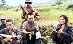 Japanese resistance fighters captured, Okinawa, Japan, Jun 1945; prisoner to the far left reading American propaganda literature