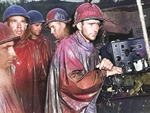 Men of the US Army 77th Infantry Division at Okinawa, Japan listening to radio reports for the German surrender, 8 May 1945