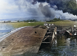 Minelayer USS Ogala capsized at Pearl Harbor, Oahu, US Territory of Hawaii, Dec 1941; note overturned Oklahoma upright Maryland in background