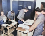 US Army Lieutenant A. H. Hadden and his staff working on passes issued to participants of the Potsdam Conference, Germany, 14 Jul 1945